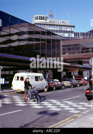 Airport control tower and terminal building; Manchester International Airport, Greater Manchester, England, UK. Stock Photo