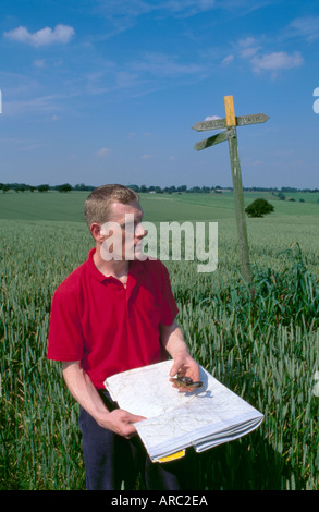 Hike using map and compass to find his location near the villages of Barwick in Elmet and Scholes, Yorkshire United Kingdom Stock Photo