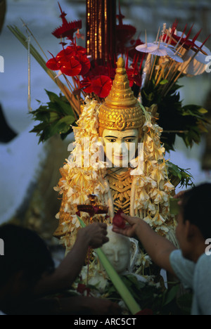 Religious offerings at the Shwedagon Paya (Shwe Dagon Pagoda), Yangon (Rangoon), Myanmar (Burma), Asia Stock Photo