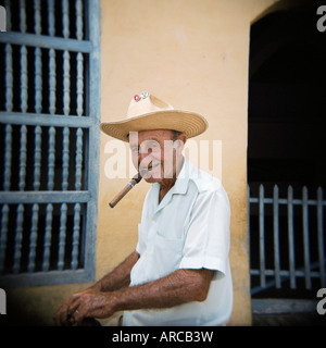 Old man smoking cigar, Trinidad, Cuba, West Indies, Central America Stock Photo