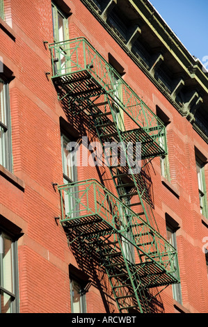 Fire escapes on the outside of buildings in Spring Street, Soho, Manhattan, New York City, New York, USA, North America Stock Photo