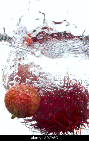 Rambutan and Lychee splashing in water Stock Photo