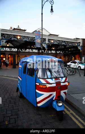 Union Jack design on TucTuc/Tuk Tuk /Auto Rickshaw outside Brighton railway station, UK Stock Photo