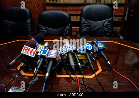 A collection of microphones from television and radio stations at a news conference Stock Photo