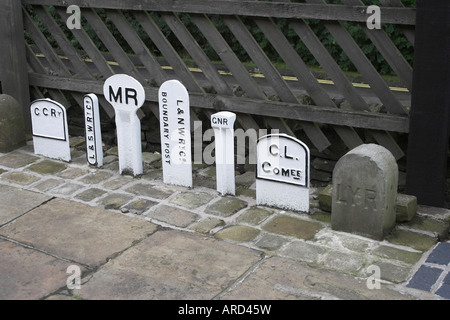 Railway mile posts on display at Ingrow West Station. Keighley and Worth Valley Railway, Yorkshire, United Kingdom. Stock Photo