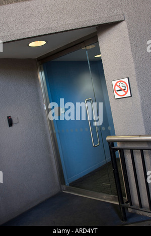 Entrance to building with no smoking sign on wall City of London GB UK Stock Photo