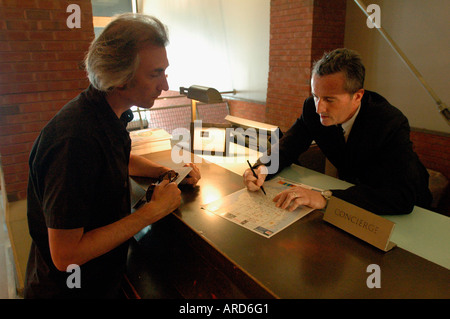 Concierge assists a visitor at the Soho Grand Hotel on West Broadway in Soho in NYC Stock Photo