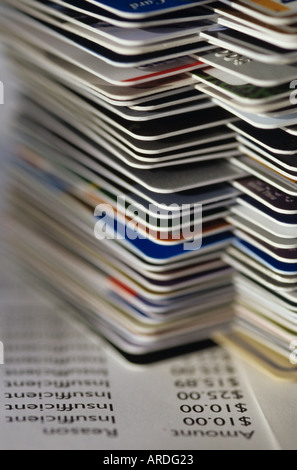 Credit cards stacked on table with past due accounts and insufficient funds Marysville Washington USA Stock Photo