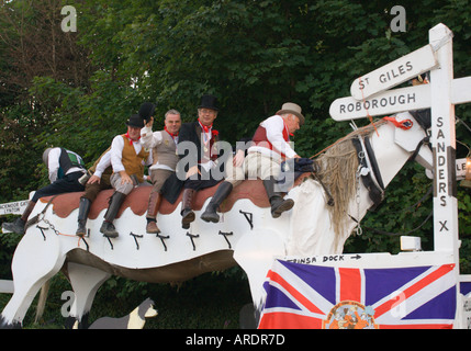 Huge white painted wooden horse in summer carnival street procession in seaside town of Ilfracombe North Devon England Stock Photo