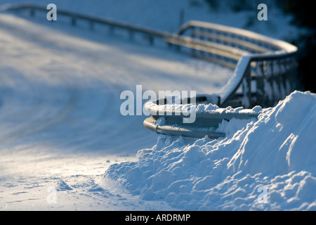 Metallic snowy road bridge railing at Winter , Finland Stock Photo