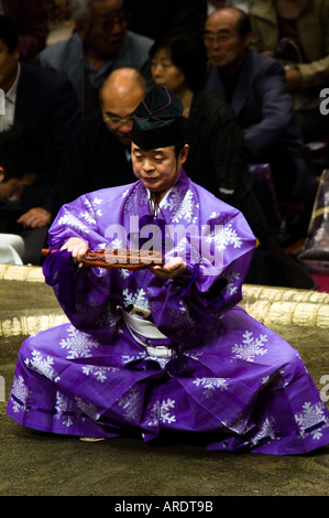 A sumo official signals to the wrestlers at the Ryogoku stadium in Tokyo Japan Stock Photo