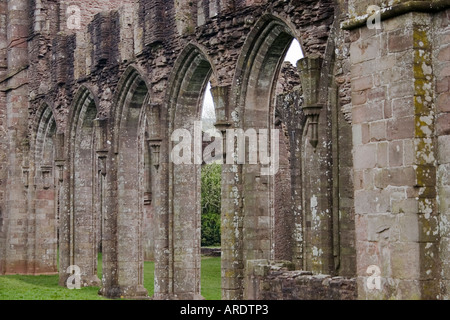 Arches leading into the nave of the ruined 13C Llanthony Abbey in the Honddu Valley Black Mountains SE Wales Stock Photo