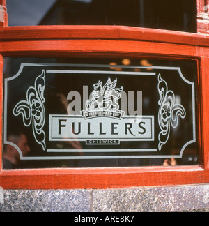 Fullers Brewery sign etched into a pub window London England UK Stock Photo