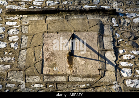 SUNDIAL MOUNTED ON WALL BRASSINGTON DERBYSHIRE ENGLAND Stock Photo