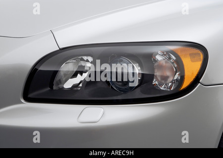 2006 Volvo C70 T5 in Silver - Headlight Stock Photo