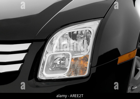 2006 Ford Fusion SEL V6 in Black - Headlight Stock Photo