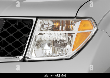 2006 Nissan Pathfinder LE in Silver - Headlight Stock Photo