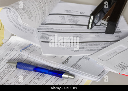 Personal finance letters pile of monthly bill bills household from above paperwork mail top view close up nobody none no one in USA Stock Photo