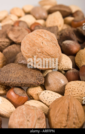 Various kinds of nuts in shells from above overhead nobody full  blurred blurry background from abobe overhead vertical hi-res Stock Photo