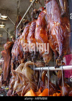 Hanging BBQ'd ducks in Chinese restaurant. Stock Photo