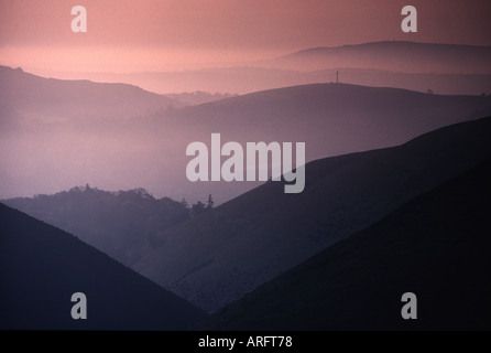 Morning mist hangs over peaceful hills and valleys in Shropshire. Taken from the Long Mynd Stock Photo