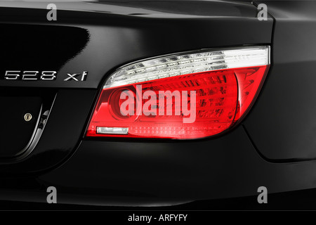 2008 BMW 5-Series 528xi in Black - Tail light Stock Photo