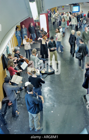 Paris France, Large Crowd People Listening to 'Classical Music' Performance in Hallway of 'Paris Metro' 'Chatelet les Halles' Station Stock Photo