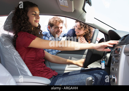 Teenager and Family Shopping For New Car