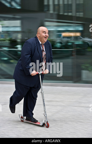 Businessman on Scooter Stock Photo