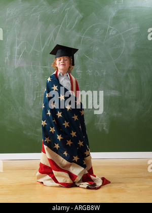 Boy Wearing American Flag and Graduation Hat Stock Photo