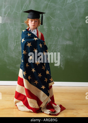 Boy Wearing American Flag and Graduation Hat Stock Photo