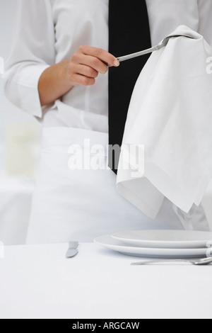 Waiter Polishing Silverware