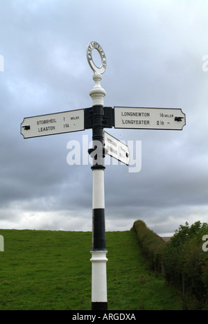 Old fashioned black and white finger post in East Lothian, Scotland, UK Stock Photo