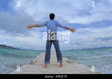 Man Standing on Pier Stock Photo