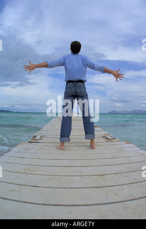 Man Standing on Pier Stock Photo