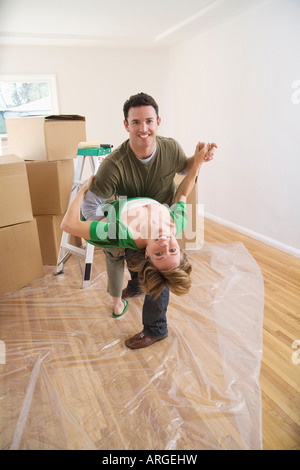 Couple Dancing in New Home Stock Photo