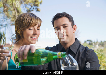 Couple Drinking Sparkling Water Stock Photo