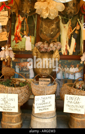 Boars head display outside one of the many foodshops in NORCIA gourmet capital of Umbria in Italy Stock Photo
