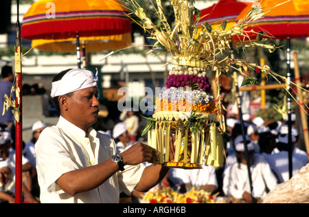 Kuta Beach, Ceremony Bali funereal cremation Balinese funeral procession, faith offering, Hindu universe, crowd, group, people, men, women, Indonesia, Stock Photo