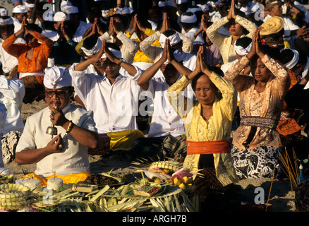 Kuta Beach, Ceremony Bali funereal cremation Balinese funeral procession, faith offering, Hindu universe, crowd, group, people, men, women, Indonesia, Stock Photo