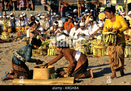 Kuta Beach, Ceremony Bali funereal cremation Balinese funeral procession, faith offering, Hindu universe, crowd, group, people, men, women, Indonesia, Stock Photo