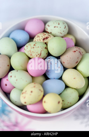 Sugars shell coated chocolate eggs in a vintage china cup and saucer Stock Photo