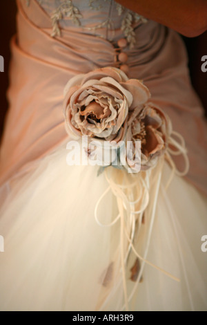Detail of a brides dress with cloth flowers Stock Photo