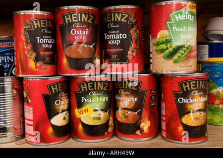 various assorted varieties tin cans of Heinz soups on a kitchen shelf, Britain UK Stock Photo