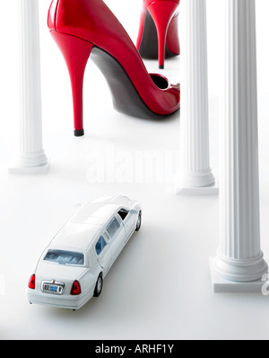 large red shoes with white limo in foreground Stock Photo