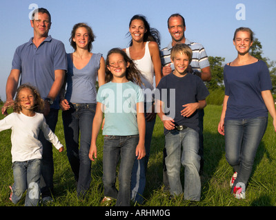 Group of people and children walking Stock Photo