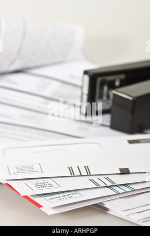 Personal finance letters pile of monthly bill bills household from above paperwork mail top view close up nobody none no one in USA US vertical hi-res Stock Photo