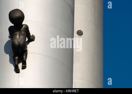 Žižkov Television Tower, with one of the David Černý baby sculptures attached to one of the pillars. Prague, Czech Republic. Stock Photo