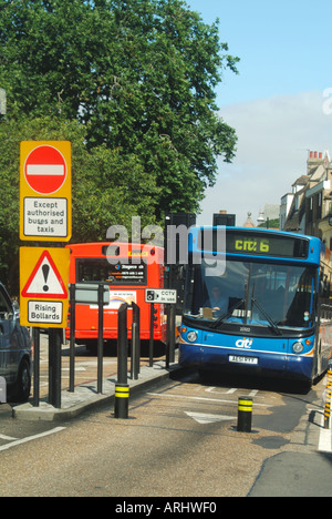 Cambridge university town Citi bus entering restricted traffic zone entry controlled by automated rising bollards Stock Photo