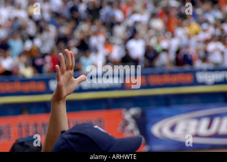 single hand reaching towards sky at a Detroit Tiger Professional Major League Baseball game at Comerica Park Detroit Michigan Stock Photo